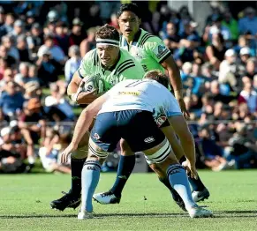  ??  ?? The Highlander­s’ Luke Whitelock is tackled by Will Miller of the Waratahs during the Super Rugby trial match in Alexandra last week.