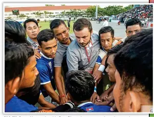  ??  ?? ALL IN: Conor Nestor gives his Svay Rieng players a run-through on tactics