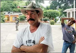  ?? Los Angeles Times/RICHARD FAUSSET ?? Artemio Rosas (left), a surf shop owner and real estate broker in Arroyo Seco, says good jobs will be created and his businesses will flourish if foreigners are permitted to buy coastal property in Mexico. But farmworker Roberto Gudino (right) worries...