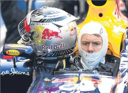  ??  ?? Vettel in the pit lane before the Abu Dhabi grand prix earlier this month.