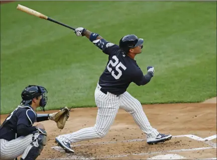  ?? KATHY WILLENS — THE ASSOCIATED PRESS ?? New York Yankees’ Gleyber Torres follows through on his swing during an intrasquad baseball game Monday, July 6, 2020, at Yankee Stadium in New York. At left is catcher Kyle Higashioka.