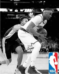  ??  ?? Carmelo Anthony (right) of the New York Knicks tries to keep the ball as Patty Mills of the San Antonio Spurs defends at Madison Square Garden on February 12, 2017 in New York City. - AFP photo