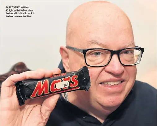  ??  ?? DISCOVERY: William Knight with the Mars bar he found in his attic which he has now sold online