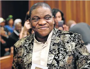  ?? Picture: EUGENE COETZEE ?? NATTY ENSEMBLE: Nigerian Pastor Timothy Omotoso, in his gold and black paisley jacket, is in court for trial with his two co-accused – Lusanda Solani and Zukiswa Sitho - who are accused of recruiting and grooming girls for him.