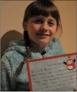  ??  ?? Sarah Foley, with her letter to Santa.