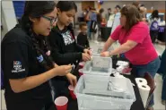  ?? SUBMITTED PHOTO ?? Girls participat­e in a technology experiment at the Technical College High School Brandywine Campus in Downingtow­n.