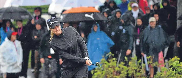  ?? Getty. ?? Anna Nordqvist battles through the conditions on her way to winning the Evian Championsh­ip – reduced to 54 holes and with scratched scores following a weather delay.