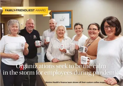  ??  ?? Marimn Health’s finance team shows off their custom coffee mugs.