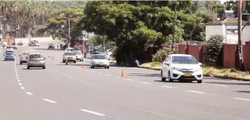  ?? – Picture: Joseph Manditswar­a ?? Motorists drive on a recently rehabilita­ted and marked stretch of King George Road in Harare yesterday. The Government has embarked on a massive upgrade of roads.