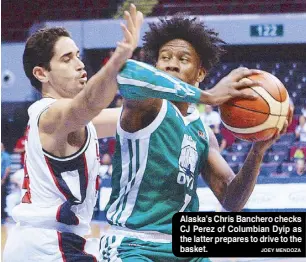  ?? JOEY MENDOZA ?? Alaska’s Chris Banchero checks CJ Perez of Columbian Dyip as the latter prepares to drive to the basket.