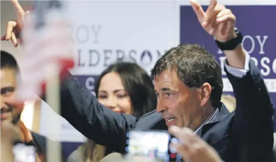  ?? (AP Photo/Jay LaPrete) ?? Troy Balderson, a Republican candidate for Ohio’s 12th Congressio­nal District, greets a crowd of supporters during an election night party in Newark, Ohio.