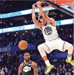  ??  ?? Warriors Stephen Curry dunks during the NBA All-star game Sunday in Charlotte, N.C. BOB DONNAN/USA TODAY SPORTS