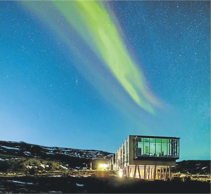  ?? ALAMY ?? STILT WALKING: The Northern Lights are seen over the Hotel ION, near to the Nesjavelli­r Geothermal Power Station in Iceland