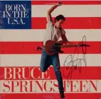  ?? ?? The cover of the Born in the U.S.A. single featured Bruce Springstee­n jumping in the air with his guitar – this one was autographe­d by Springstee­n
