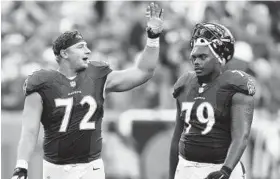  ?? DAVID RICHARD/ASSOCIATED PRESS ?? Left guard Alex Lewis, left, and left tackle Ronnie Stanley sat out their second straight day of practice Thursday. Lewis is recovering from a concussion, Stanley from a foot injury.