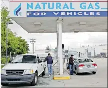  ?? Herald Archive, Bloomberg ?? Above, a natural gas station in Salt Lake City, Utah. Honda Motor Co., the only automaker selling compressed natural gas-powered cars to U.S. drivers, wants some of its dealers to also install pumps to sell the fuel as it seeks to double sales of CNG...