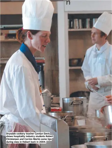  ?? ?? Drysdale cookery teacher Carolyn Davis shows hospitalit­y industry students Robert Christense­n and Corrinn Martin some tips during class in Hobart back in 2004.