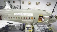  ?? — AFP ?? A Bombardier CSeries jet is seen under constructi­on the company’s plant in Mirabel, Quebec, Canada.