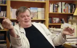  ?? JEFF BAENEN — THE ASSOCIATED PRESS FILE ?? In this file photo, Garrison Keillor, creator and former host of, “A Prairie Home Companion,” talks at his St. Paul, Minn., office. Minnesota Public Radio provided additional details of allegation­s of sexual harassment against Keillor on Tuesday.