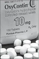  ?? [THE ASSOCIATED PRESS FILE PHOTO] ?? Researcher­s want to replace painkiller­s, such a OxyContin, with substitute­s that are not addictive. Tens of thousands of people in America are dying of overdoses every year.