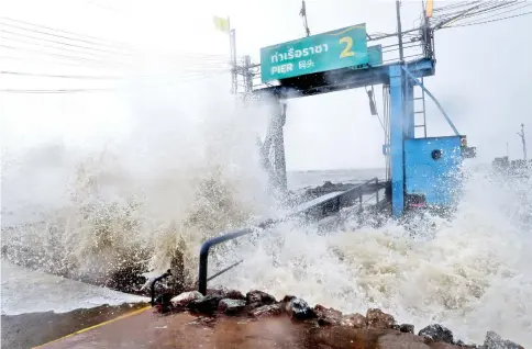  ??  ?? Waves due to Pabuk crash into a pier in the southern Thai province of Surat Thani. — AFP photo