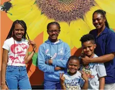  ?? PHOTO COURTESY OF TIM MCMURDO, MARKETING DIRECTOR FOR HABITAT FOR HUMANITY OF GREATER DAYTON ?? Homeowner Katara Wood with her four children: Nyelle Gilbreath, 16; Shyelle Gilbreath, 12; Ty’ahn Dearmond, 7; and TyKel Dearmond, 5.