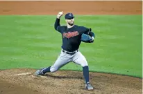  ?? PATRICK SEMANSKY/THE ASSOCIATED PRESS ?? Indians pitcher Corey Kluber tossed a three-hit shutout against the Orioles Monday in a 12-0 win.