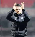  ??  ?? Thanks Stephen McGinn applauds the fans at full time