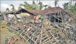  ?? SAMIR JANA/HT ?? A woman salvages her belongings from debris of her house in South 24 Parganas on Friday.