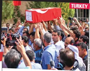  ??  ?? Grief: Mourners at funeral of a boy killed in Akcakale, Turkey