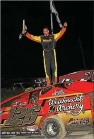  ?? SUBMITTED PHOTO - RICK KEPNER ?? Jeff Strunk, stands atop his car after winning the Freedom 76 Classic Saturday night at Grandview Speedway.