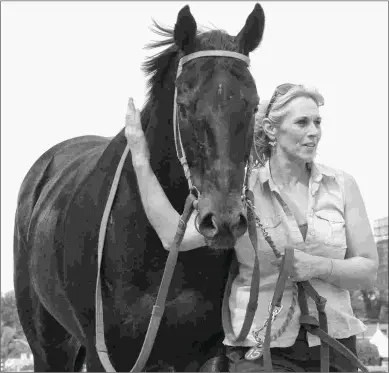  ?? BARBARA D. LIVINGSTON ?? Ben’s Cat, with his groom Fern Augusti, won five runnings of the Jim McKay Turf Sprint. nd