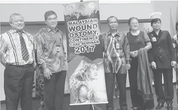  ??  ?? (From second left) Dr Chin and Dr Kamarudin are seen in a group photo with guests during the opening ceremony.
