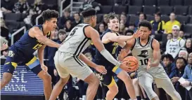  ?? ASSOCIATED PRESS ?? Marquette's Oso Ighodaro, left, played 45 minutes and Tyler Kolek fouled out in the second overtime last week against Providence in a game in which the Golden Eagles could have used some more help from the bench.
