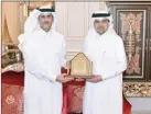  ??  ?? QIIB Chairman Sheikh Khalid bin Thani bin Abdullah al Thani honours CEO Abdulbasit Ahmad al Shaibei at an event in Doha on Wednesday.