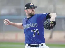  ??  ?? Rockies closer Wade Davis pitches during live batting practice at Salt River Fields last year during spring training. Davis had a disastrous 2019 season.