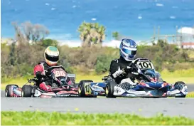  ?? Picture: DEAN HOLMES ?? CLOSE ACTION: Some hot karting action was just what was needed on a cool Saturday, and is exactly what the racers delivered at the weekend