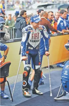  ??  ?? Lorenzo took a podium at Le Mans despite fractured ankles during the 2008 French Grand Prix. He finished second in the race, behind teammate Rossi.