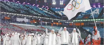  ??  ?? Le CIO a permis à plus de 160 athlètes qu’il jugeait propres de participer aux Jeux de Pyeongchan­g à titre d’athlètes olympiques de Russie, sous drapeau et couleurs neutres. - Archives