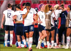  ?? ROBERT GAUTHIER/LOS ANGELES TIMES ?? Team USA forward Carli Lloyd (10) leaves her teammates to pace the field after losing a semifinal match against Canada on Monday in Kashima, Japan.