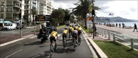  ?? AP PHOTO/THIBAULT CAMUS ?? Team Jumbo - Visma riders pedal during a training session along the beach of the Promenade des Anglais in Nice, southern France, ahead of upcoming Saturday’s start of the race, Friday. The Tour de France sets off shrouded in uncertaint­y and riding in the face of the coronaviru­s pandemic and mounting infections in France.