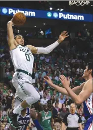  ?? AP/ELISE AMENDOLA ?? Boston rookie Jayson Tatum drives to the basket Thursday night in the Celtics’ 108-103 victory over Philadelph­ia. Tatum finished the game with 21 points.