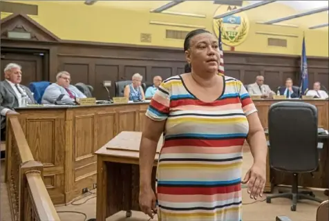  ?? Steph Chambers/ Post- Gazette photos ?? Michelle Kenney, the mother of Antwon Rose II, walks away from the podium Wednesday after speaking during an Allegheny County Council meeting on a proposal to create a county civilian police review board at the Allegheny County Courthouse. Her son, 17, was fatally shot in East Pittsburgh on June 19, 2018, by East Pittsburgh police Officer Michael Rosfeld, who was later acquitted at trial.