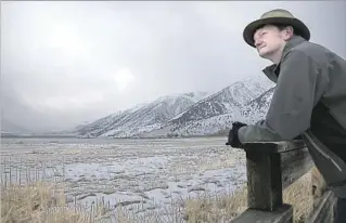  ??  ?? ANOTHER STORM last weekend helped raise the water level of Mono Lake by at least 6 inches. Above, environmen­tal activist Geoffrey McQuilkin looks out over the lake on Monday.