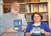  ?? / Contribute­d ?? Raymond L. Atkins recently released the new novel “Set List.” Author and historian Lisa M. Russell recently released her new book “Underwater Ghost Towns of North Georgia.” Atkins and Russell are instructor­s of English at GNTC.