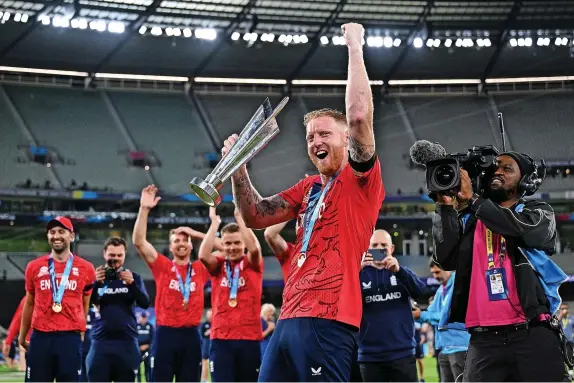  ?? PA Wire ?? >
Ben Stokes celebrates with the trophy after helping England to win the T20 World Cup final at the Melbourne Cricket Ground against India