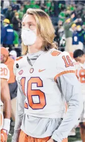  ?? MATTCASHOR­E/GETTY ?? Heisman Trophy-contending QB Trevor Lawrence missed Clemson’s double-overtime loss to Notre Dame in early November.