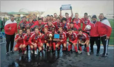  ?? JEFF DEWEES - FOR DIGITAL FIRST MEDIA ?? The Fleetwood boys soccer team poses with the PIAA championsh­ip trophy after winning the 2A title on Nov. 17.