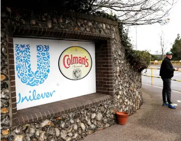  ??  ?? A man stands at the gates of the Unilever Colman’s mustard factory in Norwich. — Reuters photo