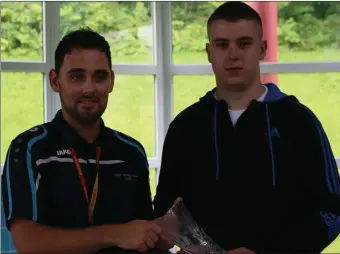  ??  ?? Owen Maughan presents Cairan Simpson with a piece of crystal in recognitio­n of his quick action of saving his life.